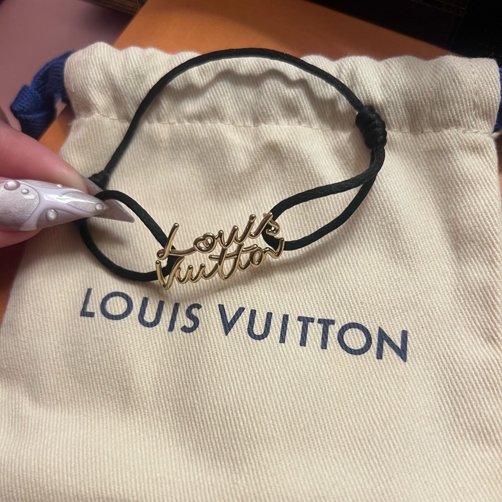 Louis Vuitton Gold Script Logo Bracelet with Black Cord Adjustable